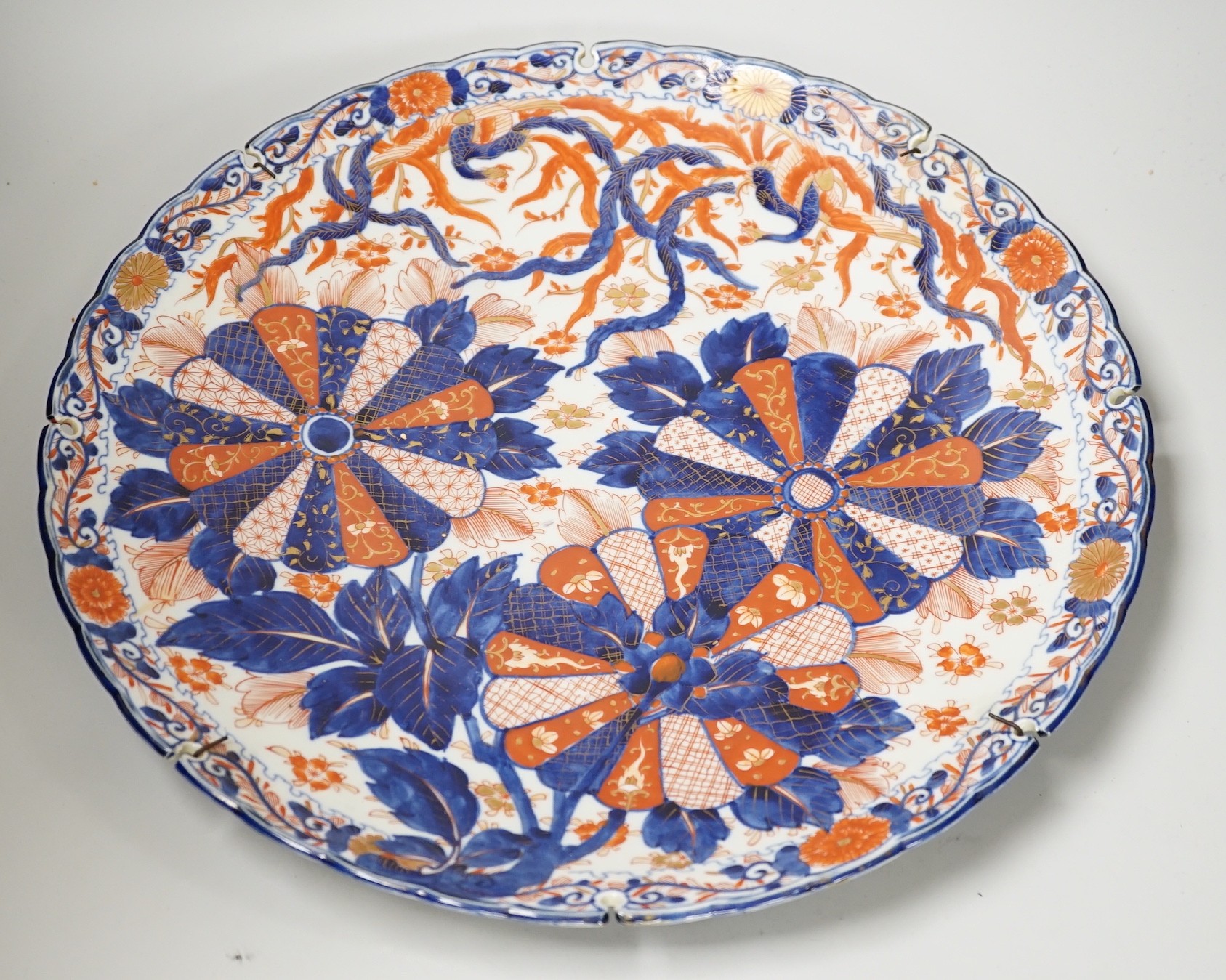 An Imari petal rimmed charger, in typical palette, Meiji period. 47cm